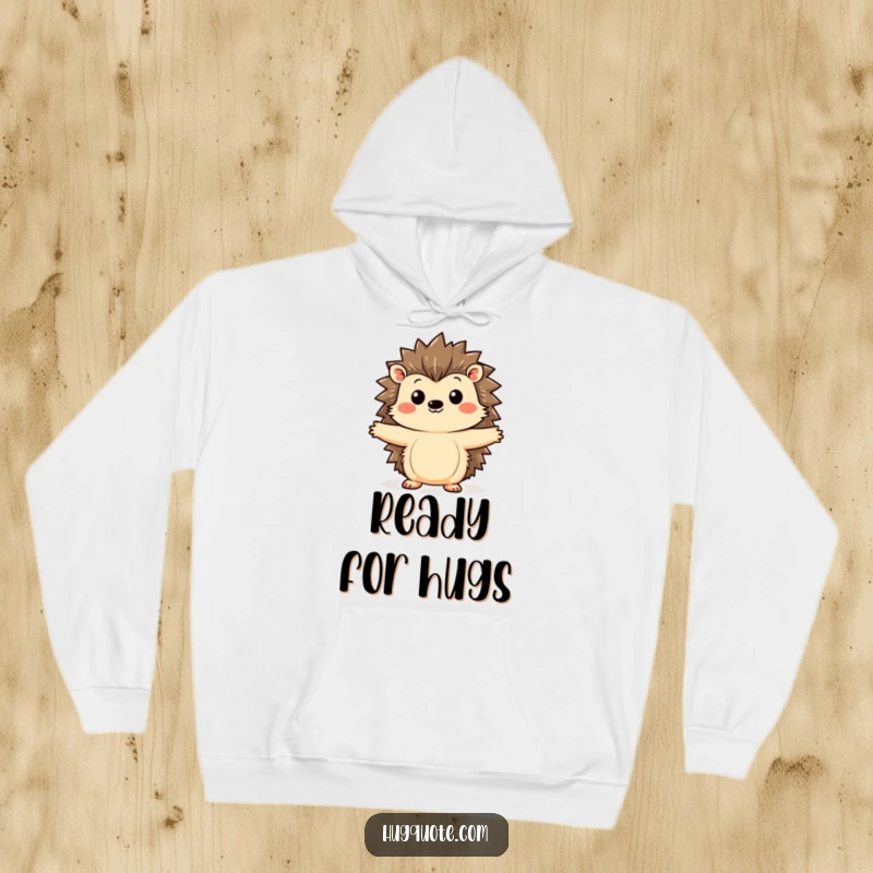 Funny hedgehog hoodie showcasing a kawaii hedgehog curiously extending its arms for a hug, designed for comfort and cute, heartwarming appeal.